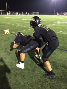 Spencer Silverstein practices handling snaps. Photo by Kevin Pan